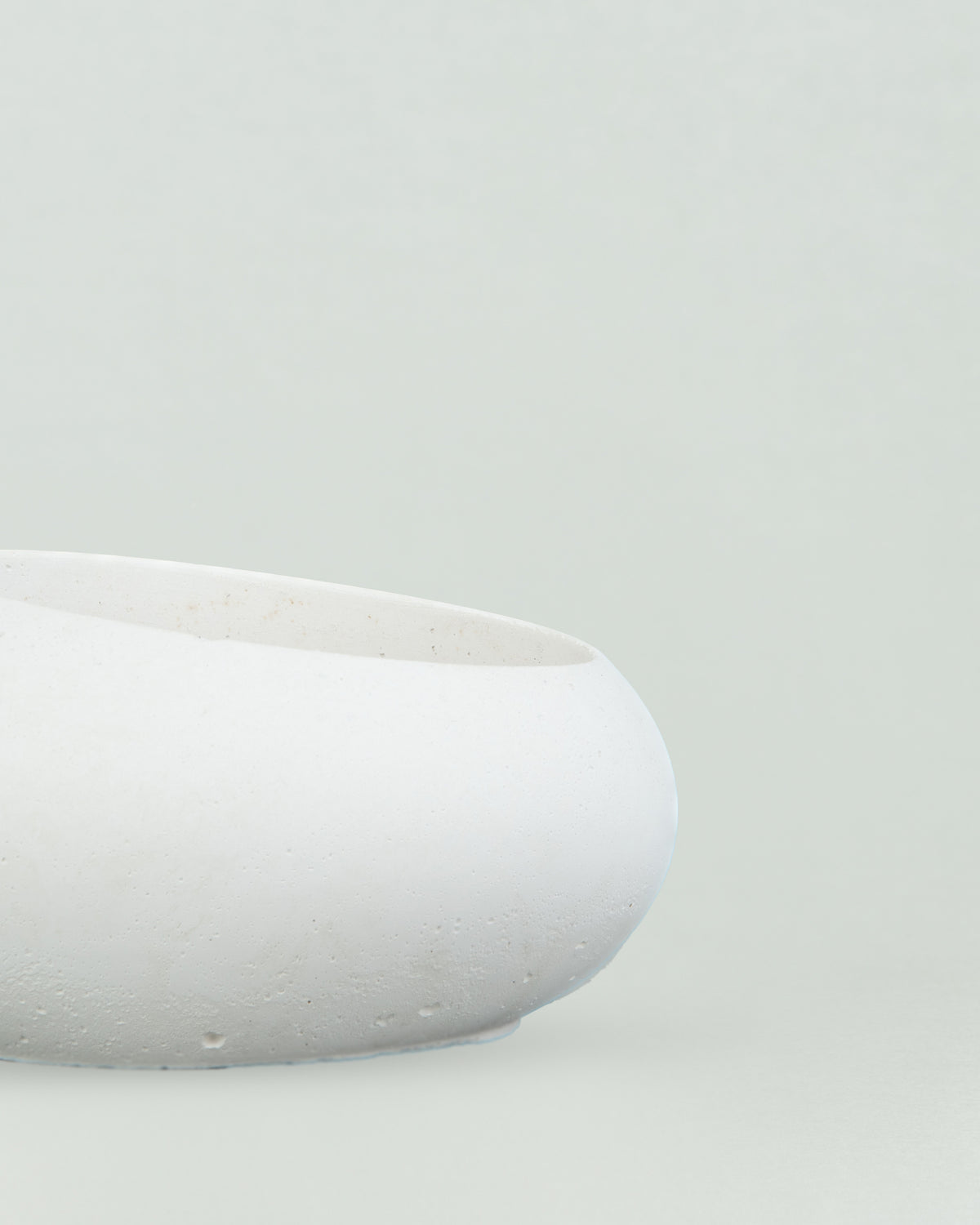 Eggquisite Charm: White Concrete Egg-Shaped Holder for Candles and Cacti