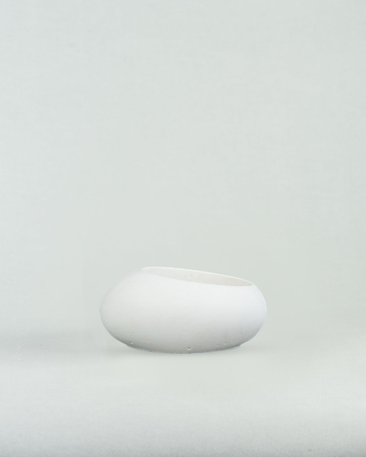 Eggquisite Charm: White Concrete Egg-Shaped Holder for Candles and Cacti
