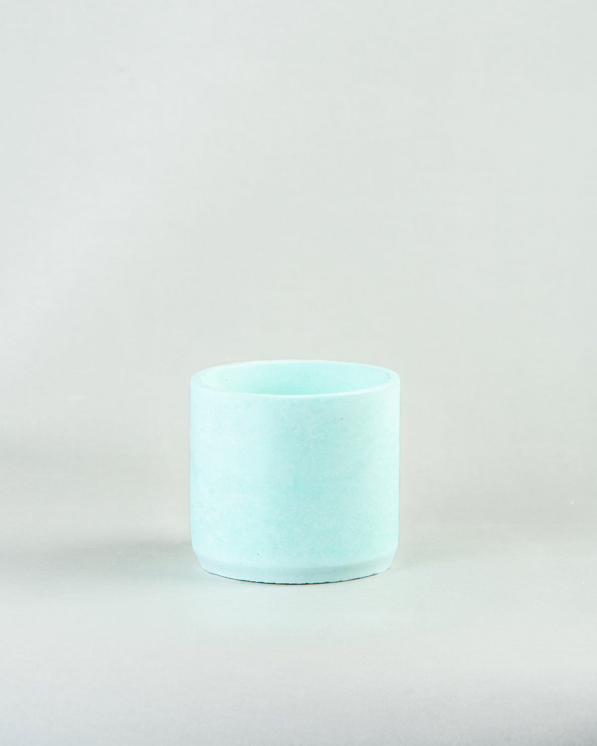 Compact Cylinder Harmony: Small Planters in Varied Hues