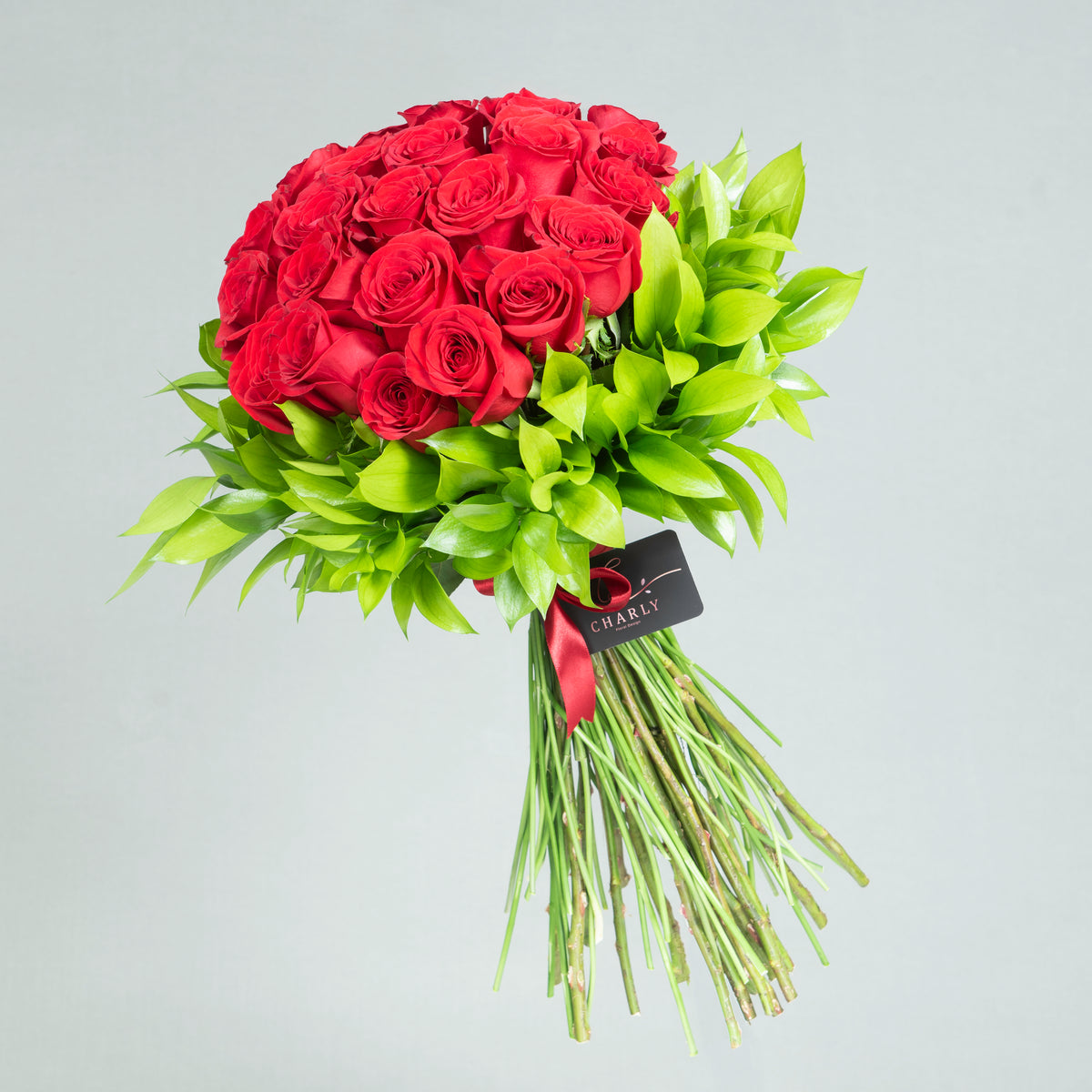 Eternal Romance: Two Dozen Red Roses with Greenery